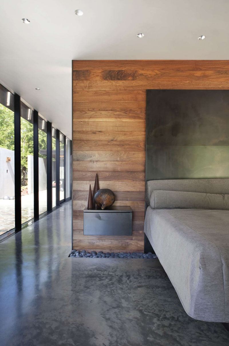 Полированный бетонный пол в современном интерьере спальни